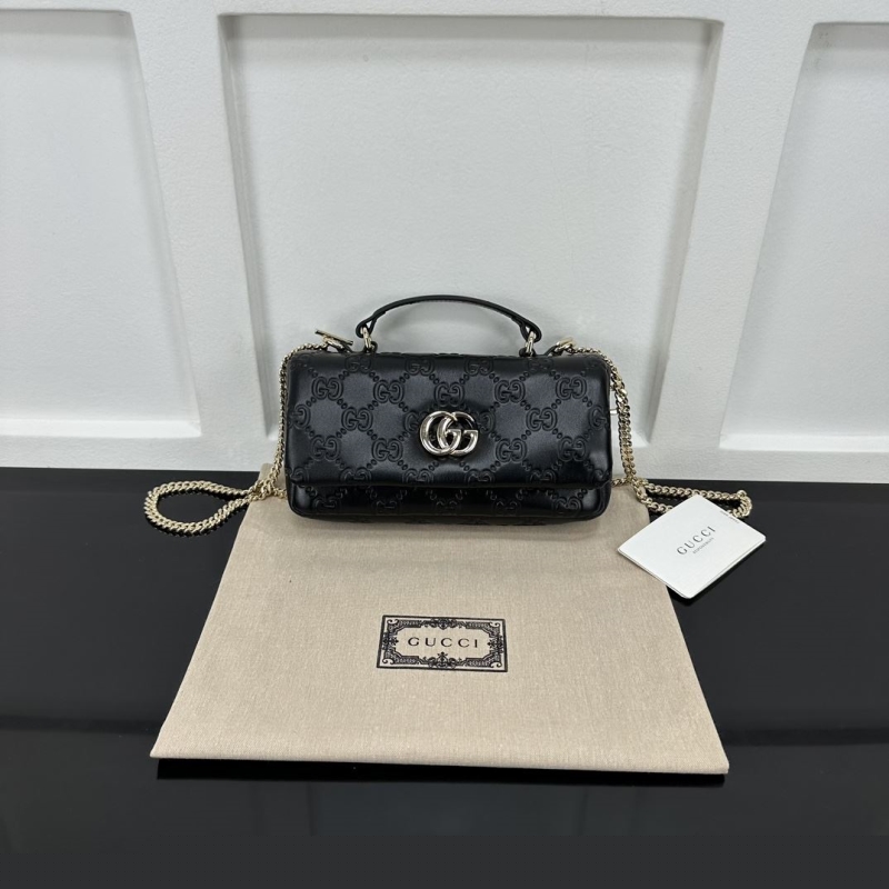 G*u*i top handle bags